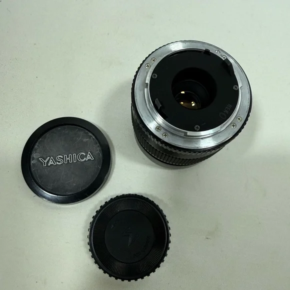 Yashica Zoom Lens 42- 75mm with case & Hakuba uv 55mm lens